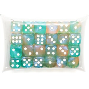 May include: A clear plastic pillow-shaped pouch containing twenty-four six-sided dice. The dice feature a swirling blend of teal, green, and orange colors with a pearlescent finish and white pips representing numbers one through six.