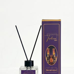 May include: A clear glass diffuser bottle with black reeds and a matching box. The box and bottle feature the text "Tortum Parfum" and "Nenehatun". The box has a purple background with a gold border and an illustration.