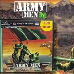 May include: A video game box for "Army Men: World War Team Assault" featuring a green flag and soldiers. The box has a "New Format" sticker and the game's title. A green plastic army man is in the foreground.