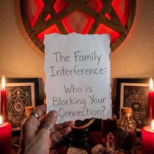 May include: A hand holds a torn piece of paper with the text "The Family Interference: Who is Blocking Your Connection?" A pentagram is lit up in red in the background, with candles and crystals on a table.