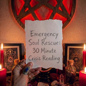 May include: A handwritten note reads "Emergency Soul Rescue: 30 Minute Crisis Reading" held in front of a red and brown pentagram. The scene includes lit red candles, framed artwork, and various crystals and bottles, creating a mystical ambiance.
