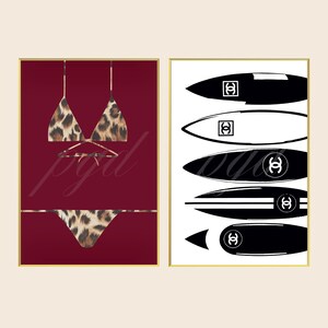 May include: Two framed wall art prints. The left print features a leopard print bikini on a deep burgundy background. The right print displays five stylized surfboard illustrations in black and white, each marked with a double C logo emblem.