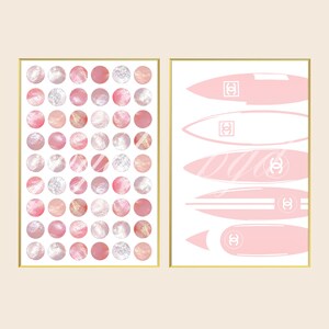 May include: Two framed wall art prints. The left print features a grid of pink and white circular patterns with varied textures. The right print displays five horizontal pink surfboard shapes, each marked with a white double C logo emblem.