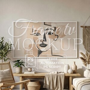 May include: A living room interior with a large framed artwork featuring a minimalist face design in neutral tones. The room includes a wooden bench, woven chair, and decorative vases, creating a modern, cozy atmosphere.