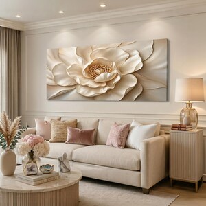 May include: A large rectangular wall art piece featuring a close-up, three-dimensional style rendering of a single cream and beige flower with layered, soft-edged petals and a textured, detailed center, displayed horizontally on a wall.