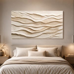 May include: A rectangular wall art piece featuring a textured, three-dimensional surface with layered, undulating wave patterns in shades of cream and beige. The artwork displays a heavy impasto technique, creating deep shadows and highlights.