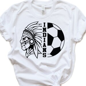 May include: White t-shirt with a black and white graphic of an American Indian chief's head and a soccer ball with the word "INDIANS" printed vertically.