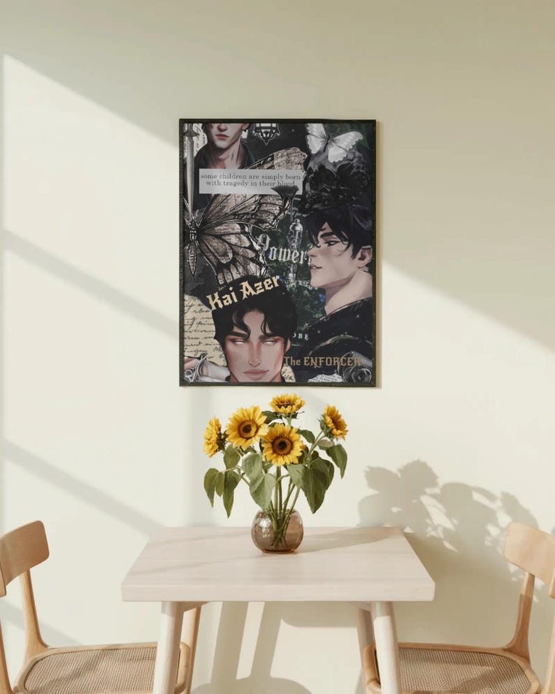 May include: A framed poster with a collage of images and text, including the words "Power" and "Kai Azer." The poster is displayed above a small table with a vase of sunflowers. The room has a neutral color palette.