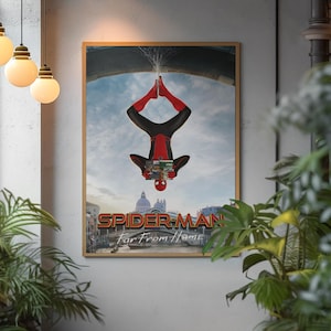 May include: A framed poster featuring Spider-Man in a red and black suit, upside down with water splashing from his feet. The poster's title reads "SPIDER-MAN Far From Home" with a cityscape background.