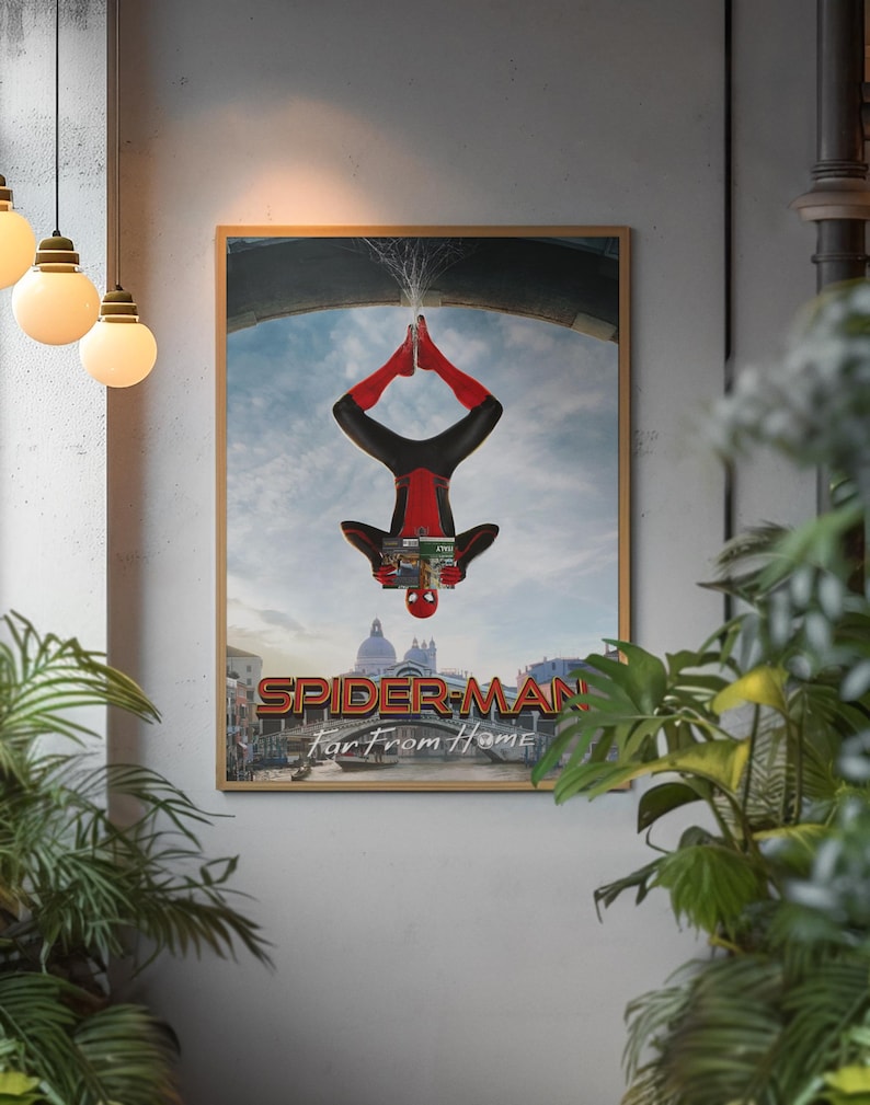 May include: A framed poster featuring Spider-Man in a red and black suit, upside down with water splashing from his feet. The poster's title reads "SPIDER-MAN Far From Home" with a cityscape background.