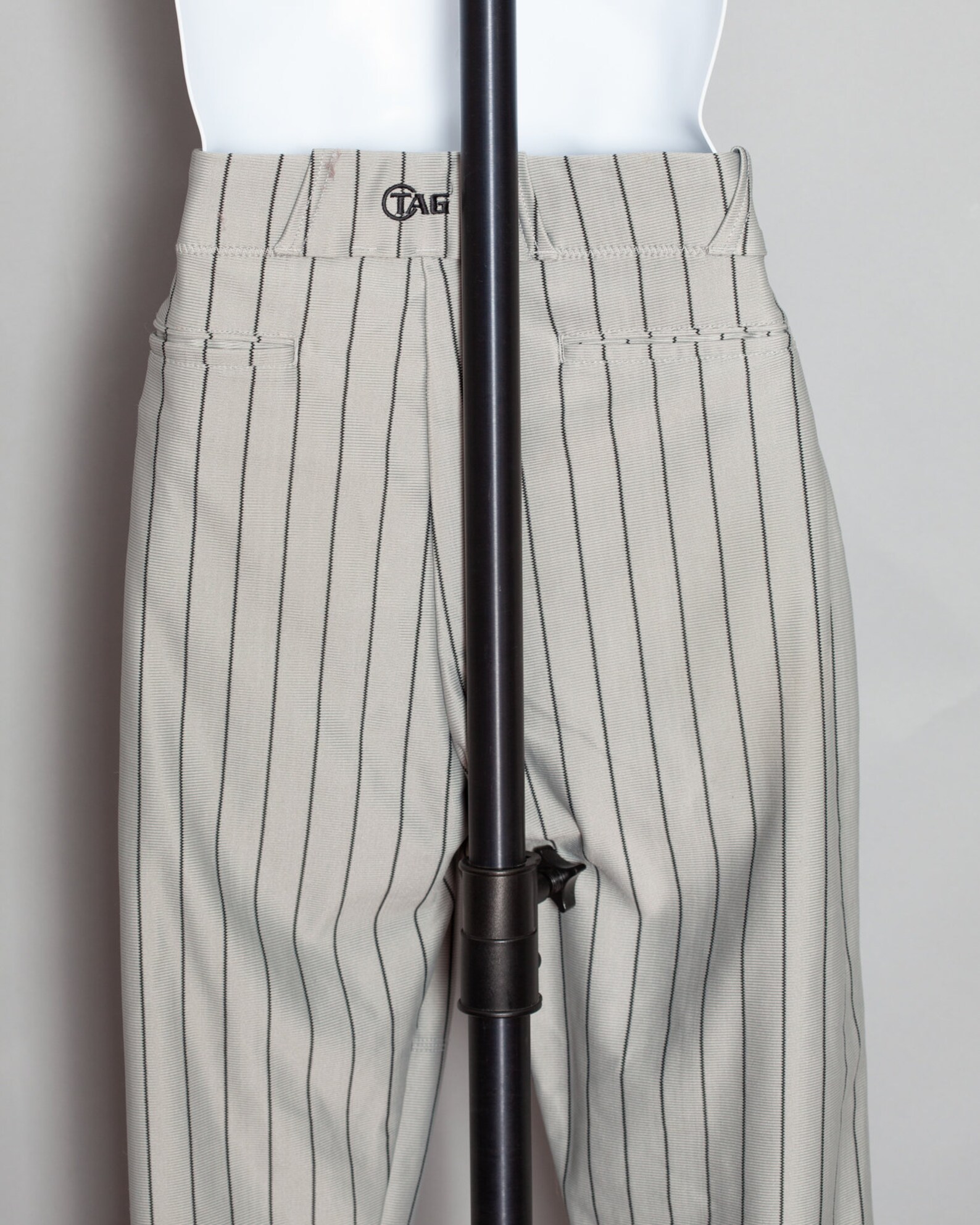 gray baseball pants with blue stripe