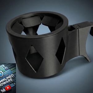 May include: Black car cup holder with diamond-shaped cutouts. The cup holder has a clip for attachment and a segmented interior. The image includes a logo with the text "STREAMLINED HARDWARE" and a YouTube play button.
