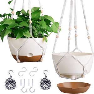 May include: Two white and brown hanging planters with macrame rope hangers and wooden beads. One planter holds a green leafy plant. Includes hanging chains, hooks, and a brown saucer. Perfect for indoor or outdoor use.