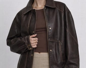 Chaqueta bomber de piel de oveja de gran tamaño de los años 90 con efecto desgastado estilo motero vintage