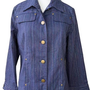 May include: A blue striped jacket with a collared neckline and gold-colored buttons. The jacket has two front pockets and gold-colored rivets. The sleeves are three-quarter length.
