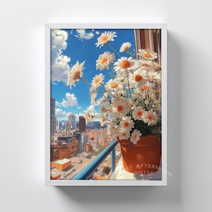 May include: A framed art print featuring a vibrant cityscape view with a pot of daisies on a balcony. The daisies have white petals and orange centers. The sky is blue with fluffy white clouds. The print is in a white frame.