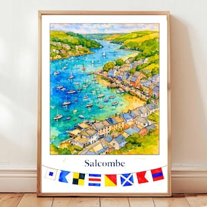 May include: Watercolor print of Salcombe, a coastal town, featuring a harbor filled with boats and surrounded by colorful buildings and green hills. The print is framed in a light wood frame and includes a banner with nautical flags. The word "Salcombe" is written below the image.