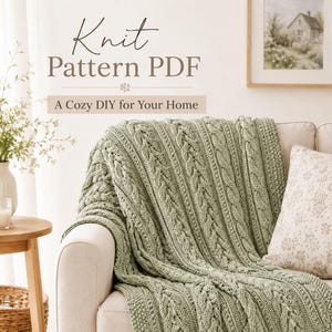 May include: A sage green knitted throw blanket with a textured cable stitch pattern draped over a sofa. The text on the image reads: Knit Pattern PDF, A Cozy DIY for Your Home. The blanket features vertical columns of braided cables.