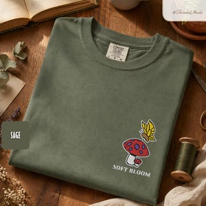 Embroidered Butterfly Mushroom Shirt, Delicate Bloom Pullover, Mossy Creature Top, Treasure for Woodland Devotees, Whimsical Wardrobe
