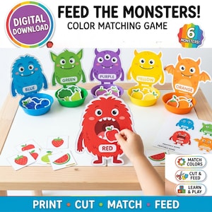 May include: A digital download color matching game featuring six colorful monster cutouts labeled blue, green, purple, yellow, orange, and red. Each monster has a matching plastic bowl and small food cards to sort by color, including fruits and vegetables.