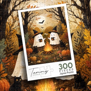 May include: A 300-piece jigsaw puzzle by Tammy Puzzle Co featuring an illustration of two ghosts wearing witch hats, roasting marshmallows over a campfire in an autumn forest with pumpkins, black cats, and a full moon in the night sky.