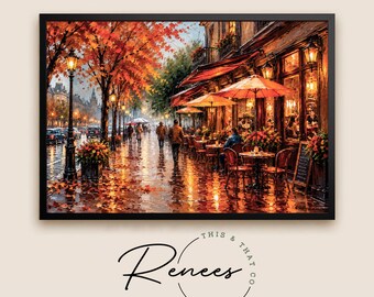 May include: A framed wall art print depicting a rainy Parisian street scene in autumn. The painting features vibrant orange and red maple trees, a sidewalk cafe with orange umbrellas, glowing street lamps, and people walking on a wet pavement.