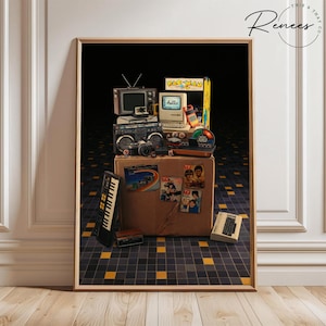 May include: A framed print featuring a collection of vintage electronics and memorabilia. Includes a small TV, boombox, camera, Pac-Man arcade game, and a computer with the word "hello" on the screen. The items are arranged on a cardboard box.
