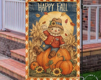 May include: A rectangular garden flag featuring the text HAPPY FALL at the top. The illustration shows a scarecrow wearing a hat and red jacket sitting on a large orange pumpkin, surrounded by corn stalks, smaller pumpkins, and sunflowers.