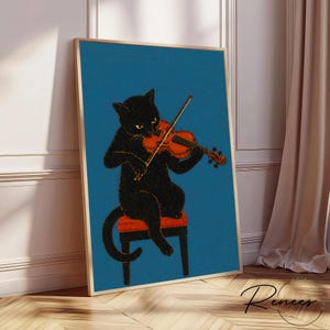 Puede incluir: Impresi&oacute;n art&iacute;stica enmarcada que muestra un gato negro tocando el viol&iacute;n. El gato est&aacute; sentado en un taburete rojo sobre un fondo turquesa. El viol&iacute;n es de color naranja y el marco es dorado.