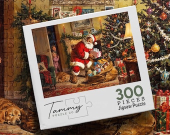 May include: A 300-piece jigsaw puzzle box featuring a festive holiday illustration of Santa Claus placing gifts near a decorated Christmas tree. The box displays the Tammy Puzzle Co logo and the text 300 PIECES Jigsaw Puzzle on a white border.