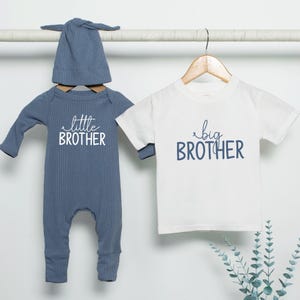 May include: A set of three ceramic vases in varying heights. The vases are white with a textured, ribbed design. The tallest vase is approximately 10 inches tall, the medium vase is 8 inches, and the smallest is 6 inches.