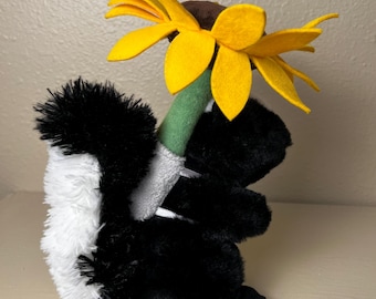 Aurora Skunk Plush Stevie Stuffed Animal Black White Skunk Holding Flower