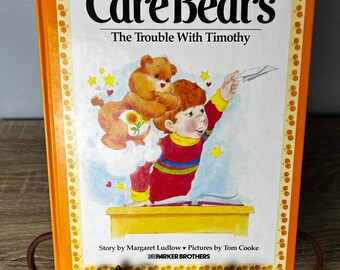 Libro de tapa dura de la colección Vintage Care Bears: The Trouble With Timothy, publicado en 1983 por Parker Brothers.