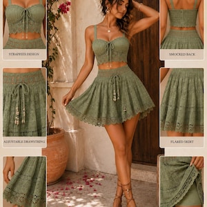 May include: Olive green two-piece set featuring a crop top with a tie detail and a flared skirt. The set includes a strappy design, smocked back, adjustable drawstring, lace hem detail, and comfortable inner shorts. The outfit is made of a delicate, open-weave fabric.