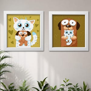 May include: Two square white-framed wall art prints. The left print features a white cat holding a brown puppy against a yellow background with heart shapes. The right print shows a brown dog holding a white kitten against a dark gold background.