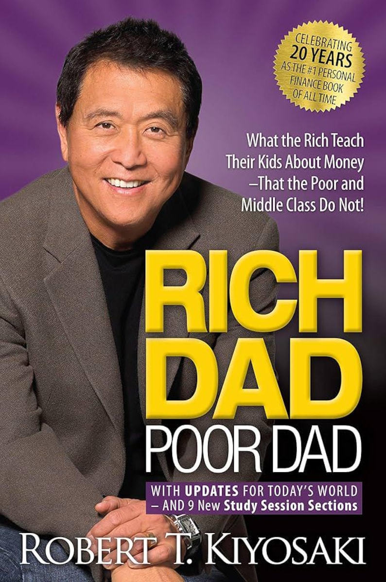 May include: Book cover for "Rich Dad Poor Dad" by Robert T. Kiyosaki. The cover features a man smiling, with the title in large yellow letters. The book celebrates 20 years as the #1 personal finance book.