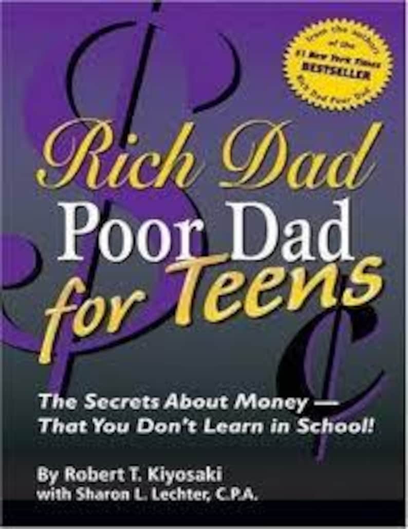 May include: Book cover for "Rich Dad Poor Dad for Teens" with a purple and gold color scheme. The title is prominently displayed, with the words "Rich Dad" and "Poor Dad" in a mix of gold and white, and "for Teens" in gold. The subtitle reads "The Secrets About Money - That You Don't Learn in School!"