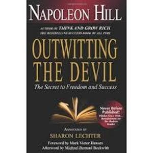 May include: A book cover for "Outwitting the Devil" by Napoleon Hill. The title is in large gold letters, with the author's name at the top. The cover is dark with a picture of an open book.