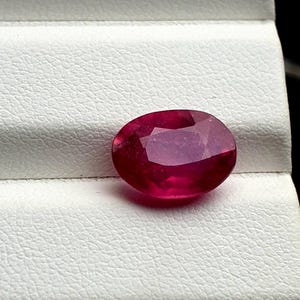 4.68 carat natural  ruby oval shaped faceted loose gemstone.