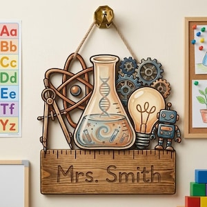 May include: A wooden teacher's sign featuring science-themed cutouts: a flask with DNA, gears, a lightbulb, and a robot. The sign has a ruler at the bottom and the name "Mrs. Smith" engraved. It hangs from a rope.