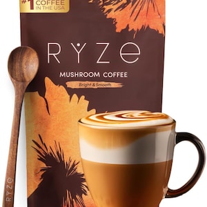 May include: A brown bag of RYZE Mushroom Coffee with a wooden spoon and a mug of coffee. The bag has the text "Mushroom Coffee" and "Bright & Smooth". The mug has a white and brown design with a swirl of foam on top.