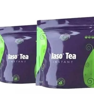 May include: Two purple and green pouches of Iaso Tea Instant. The pouches have a spiral design and the words "Iaso Tea Instant" in white. The background is a gradient of purple and green.