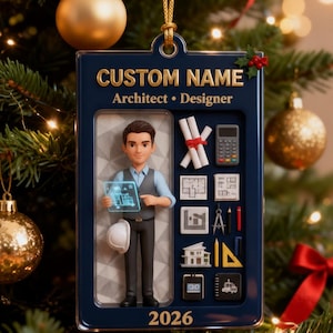May include: A rectangular navy blue Christmas ornament featuring the text CUSTOM NAME, Architect, Designer, and 2026. It displays a 3D figure of an architect holding a digital tablet, alongside miniature icons of blueprints, a calculator, and tools.