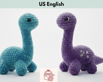 May include: Two crocheted Brontosaurus dinosaurs, one teal and one purple, are displayed. The teal dinosaur is on the left, and the purple dinosaur is on the right. The text "Dino Brontosaurus Crochet Pattern PDF US English" is at the top.