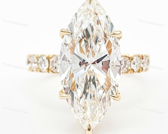 Anillo de compromiso con diamante cultivado en laboratorio certificado por IGI, talla marquesa, 3,00 quilates en total, color E-F, pureza VVS, engastado con halo oculto y diamantes redondos laterales en oro de 18 quilates.