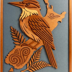 May include: Wooden wall art featuring a detailed relief of a bird perched on a branch, set against a blue-grey background. The bird and branch are crafted from various shades of brown wood, framed in a wooden border.
