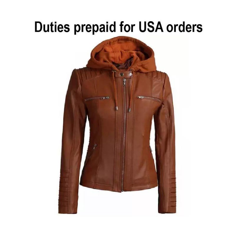 May include: A brown leather jacket with a hood. The jacket has a zipper closure, two front pockets, and decorative stitching on the shoulders and sleeves. The hood is a lighter shade of brown. The text "Duties prepaid for USA orders" is at the top.