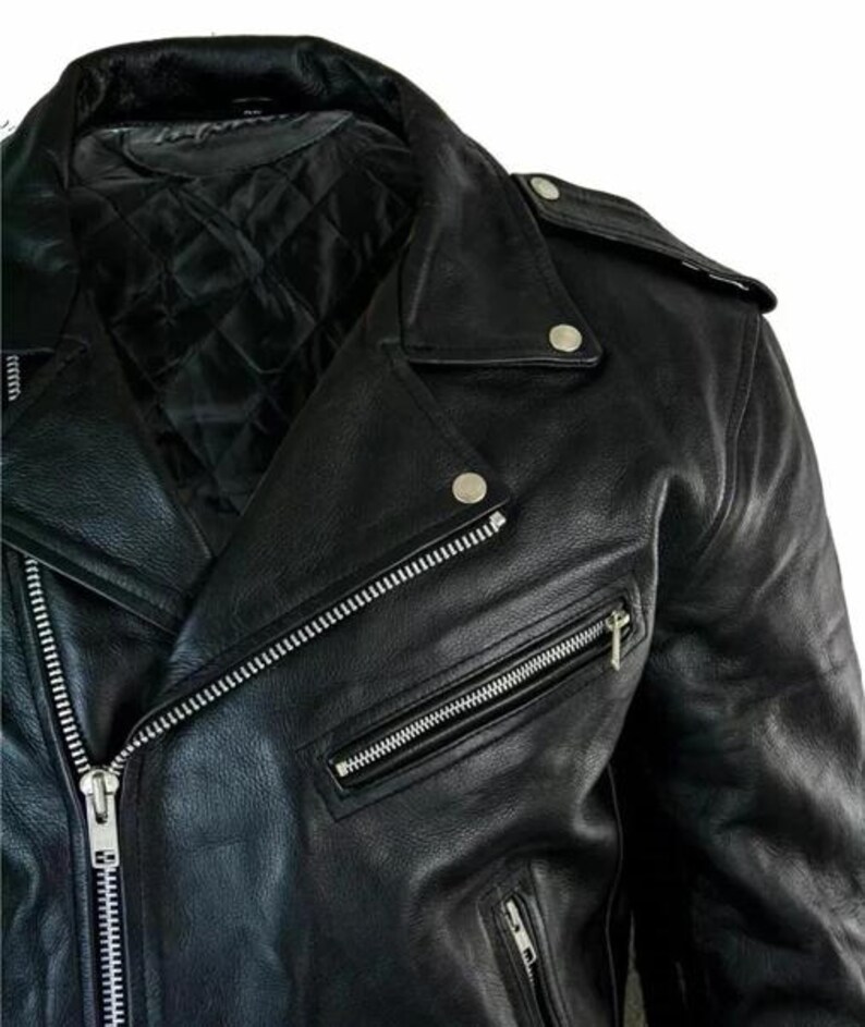 May include: Black leather motorcycle jacket with a notched collar, asymmetrical zipper closure, and multiple zippered pockets. The jacket features silver hardware, a quilted lining, and snap details on the shoulders.
