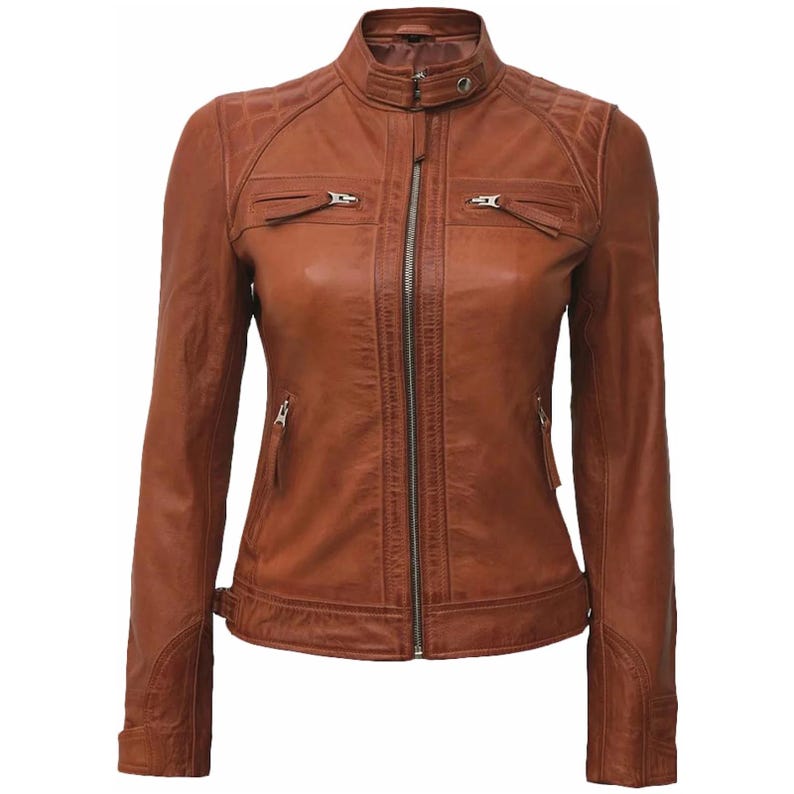 May include: A brown leather jacket with a zip-up front, two chest pockets, and two side pockets. The jacket has a quilted design on the shoulders and a stand-up collar. The jacket is a classic style.