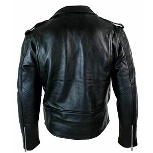 May include: A black leather jacket with a classic biker style. Features include a notched lapel, shoulder epaulets, and zippered sleeves. The jacket has a slightly asymmetrical front closure and a tailored fit.